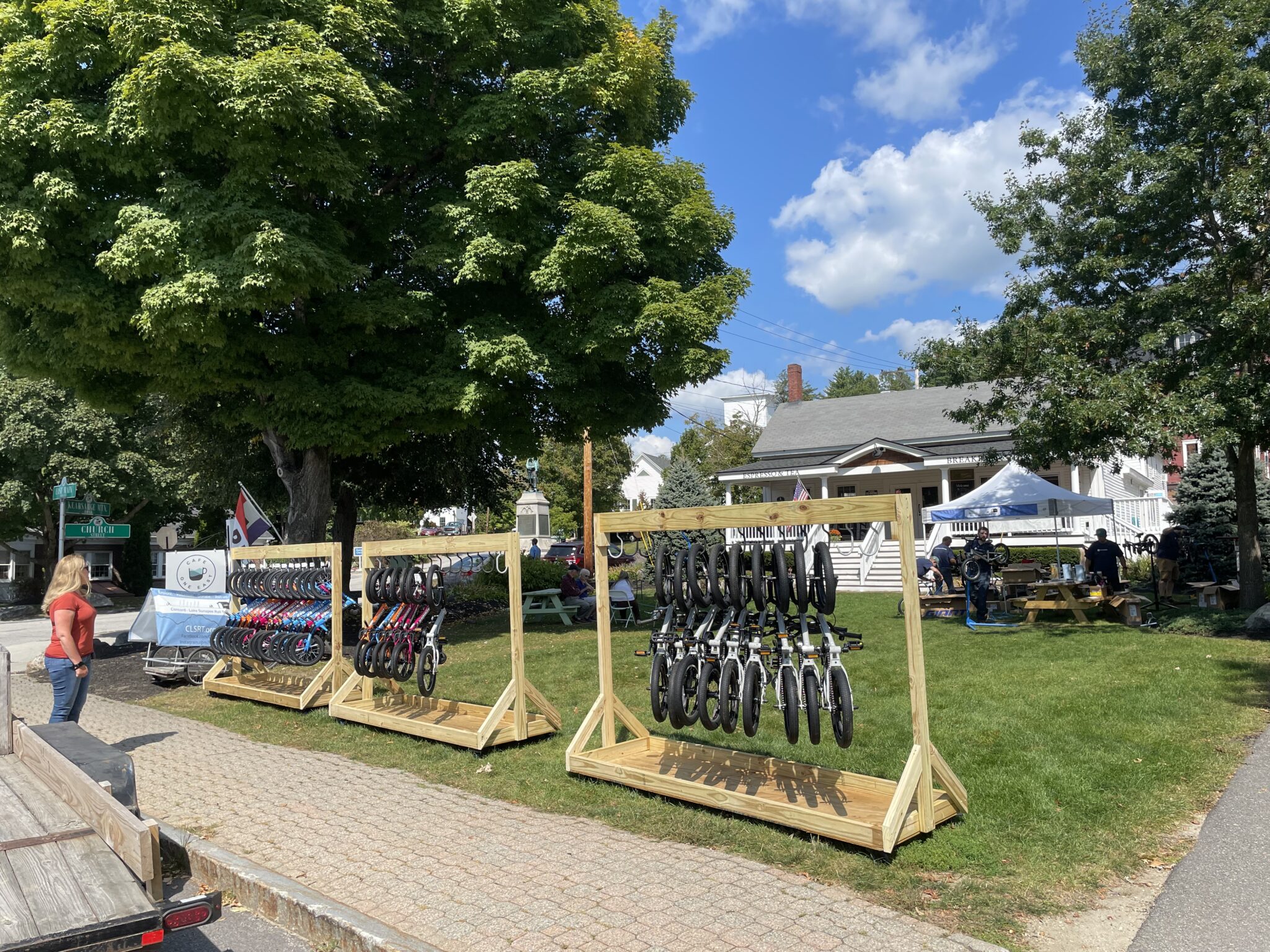 Assembled bikes hanging on racks.